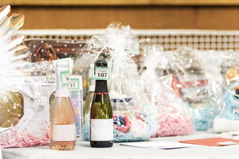 Selection of Raffle Prizes and Gift Hampers with Sparkling Wine for Charity Auction